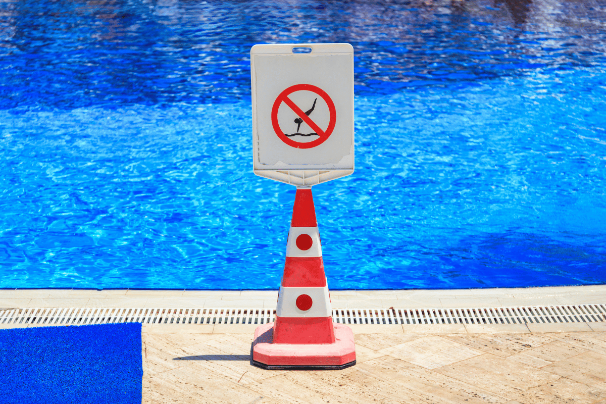 Community pool with warning sign